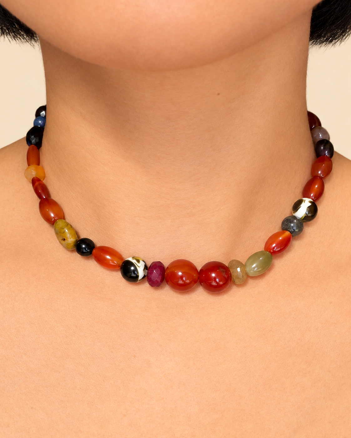 Multi-stone necklace worn as a choker