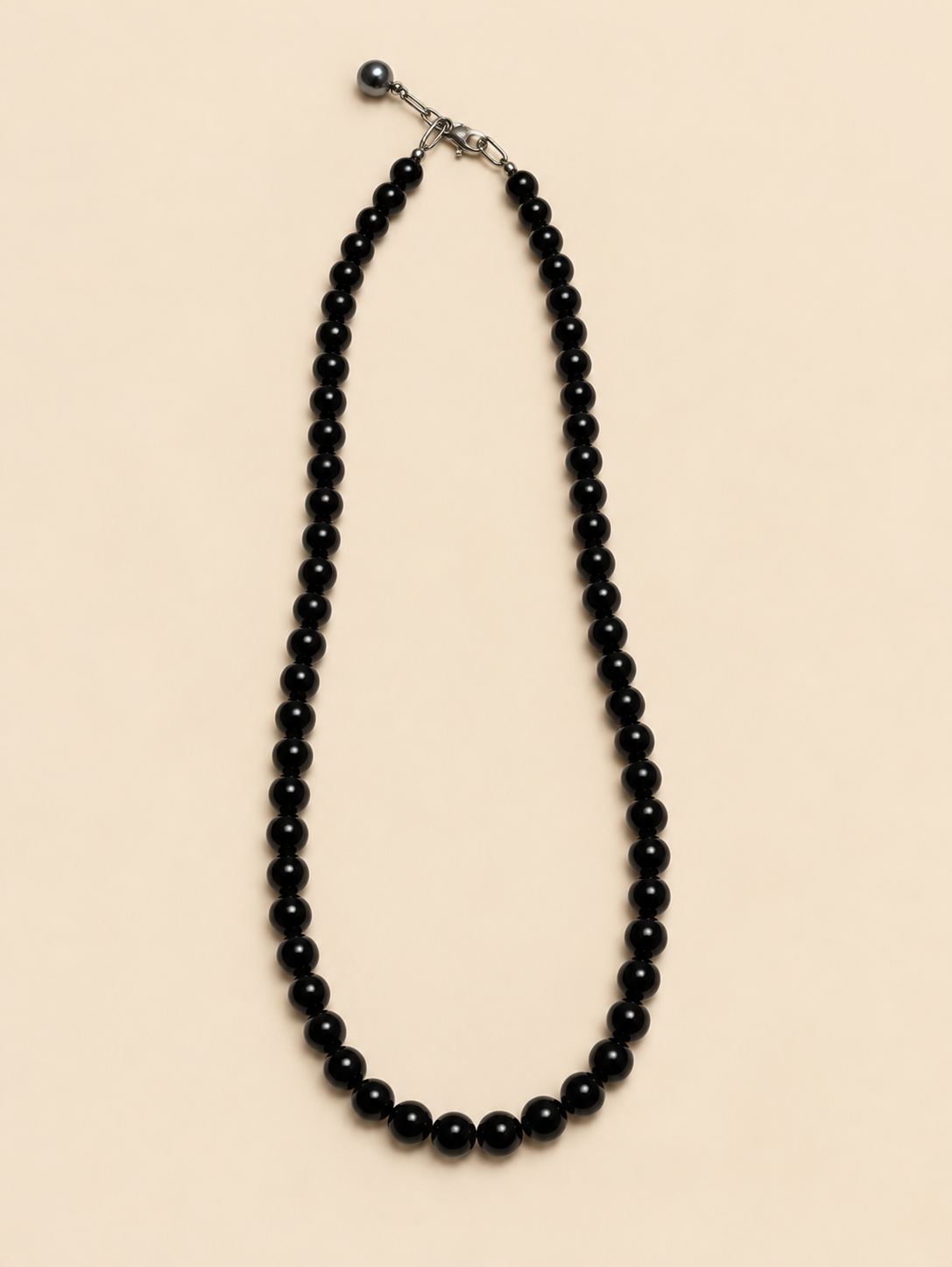 Onyx bead necklace laid flat, full length